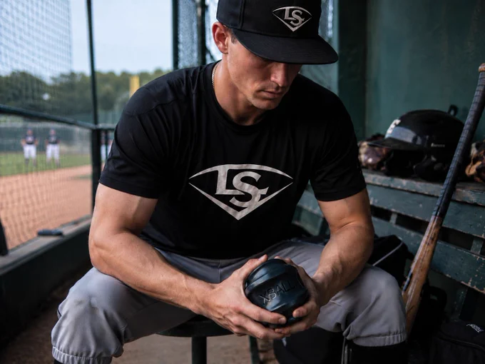 The Louisville Slugger XBALL being used for pre-game activation of hands and forearms.