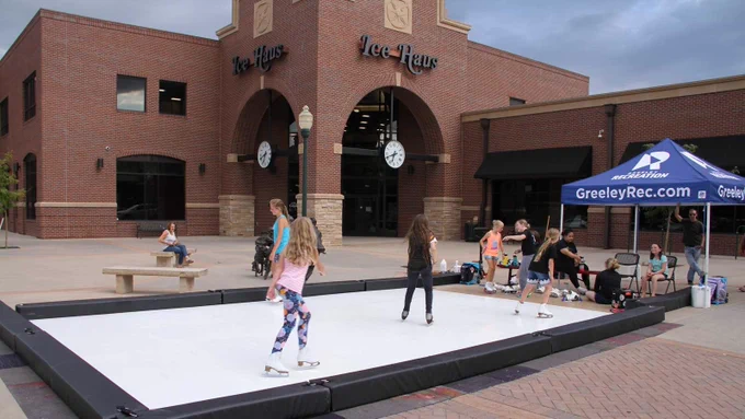 Youth try skating on the synthetic ice on the Greeley Ice Haus patio.