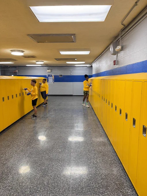 students cleaning lockers