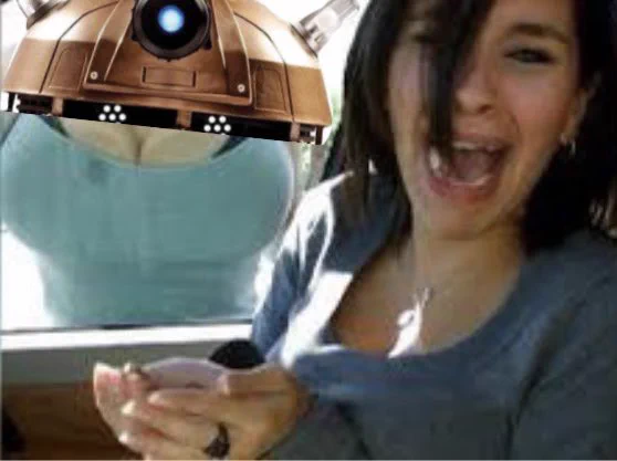 a woman screams at the camera as another woman’s boobs press up against the car window. above the boobs is a dalek’s head.