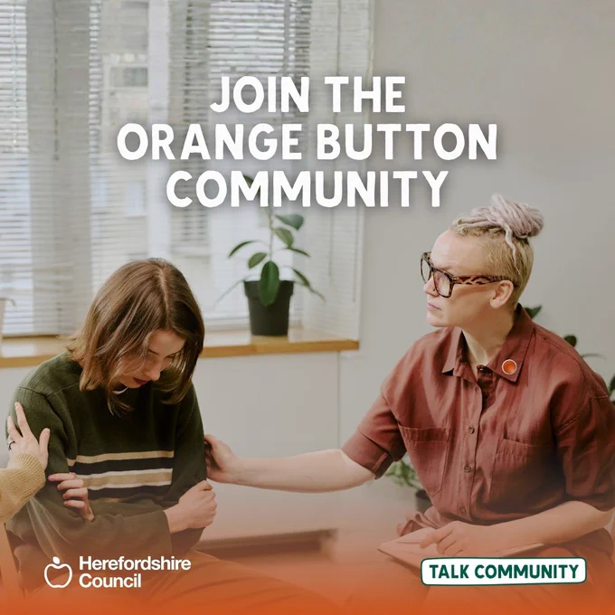 Join the Orange Button Community: A person offers comfort to another who appears distressed. Herefordshire Council initiative.