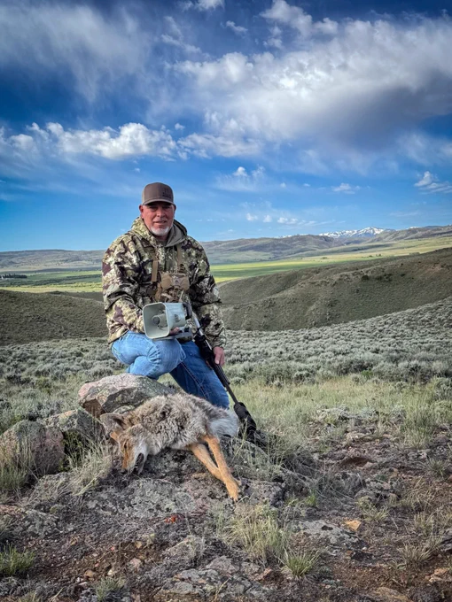 A hunter and a coyote.