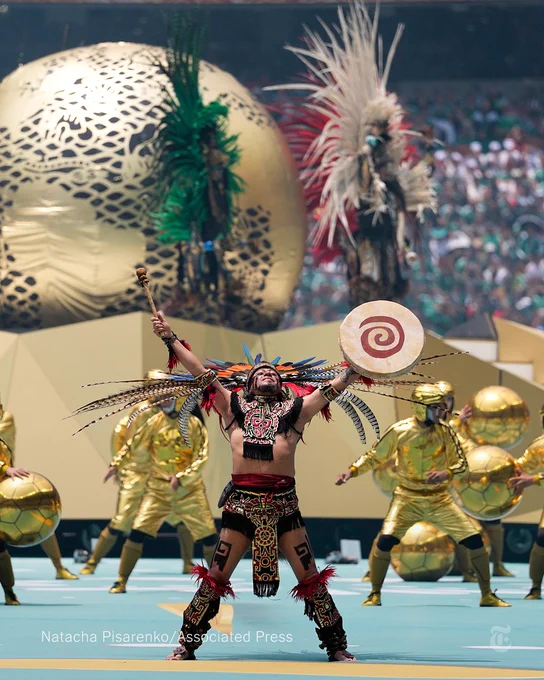 Performers on the pitch during the opening ceremony before the start of the World Cup.
