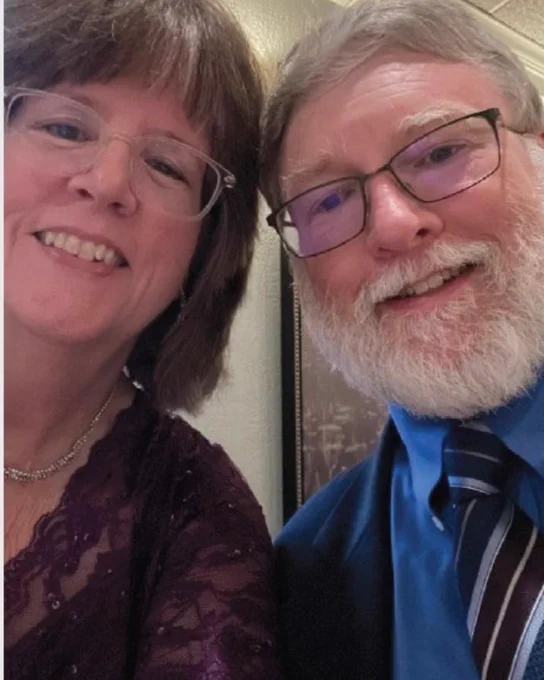 Two people smiling
