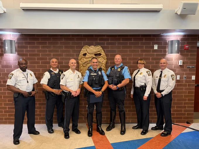 Officer Mundon pictured with members of command staff and his supervisors receiving his recognition
