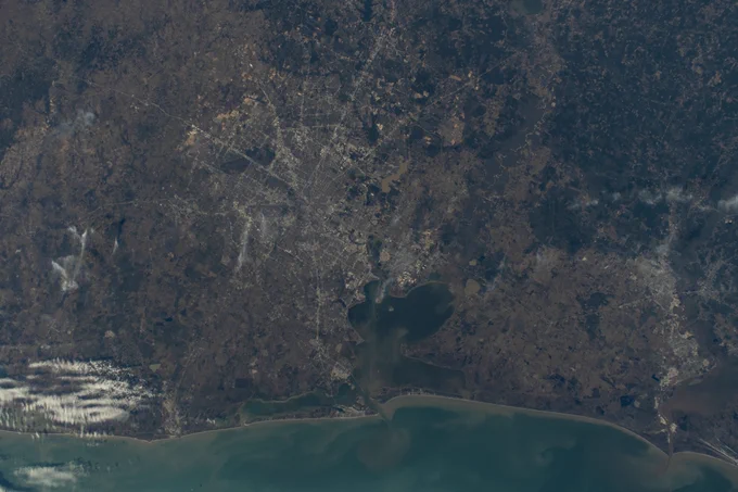 (Jan. 23, 2025) --- The Houston-Galveston area with Trinity Bay, Galveston Bay, and Lake Livingston in Texas is pictured from the International Space Station as it orbited 259 miles above central Louisiana.