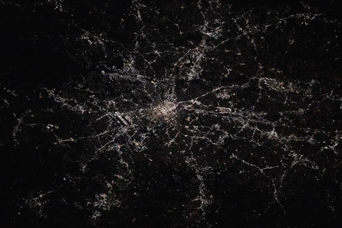 (Oct. 25, 2025) --- Atlanta, Georgia—home to the world's busiest airport, Hartsfield-Jackson Atlanta International Airport (center left), which handles over 107 million passengers annually—is pictured at approximately 2:20 a.m. local time from the International Space Station as it orbited 261 miles above North America. Atlanta is also nicknamed the "City in a Forest," with approximately 48% of its area covered in trees. Photo: NASA