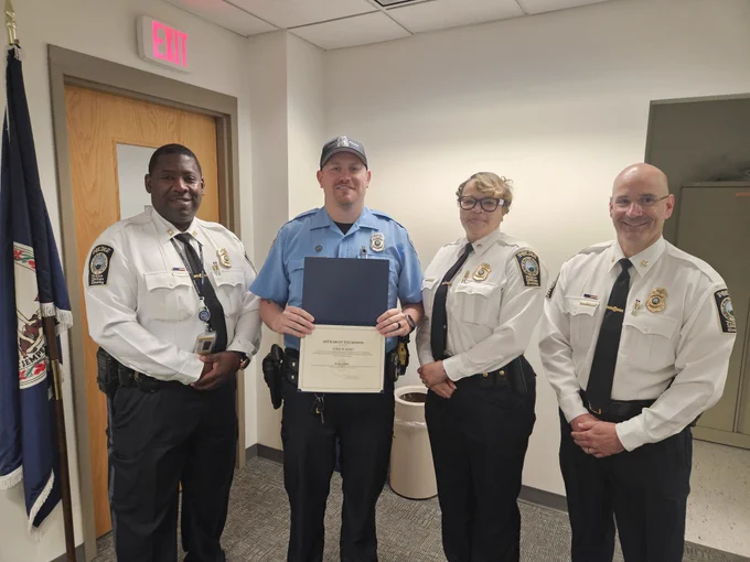 Officer Jones pictured with members of command staff receiving his recognition