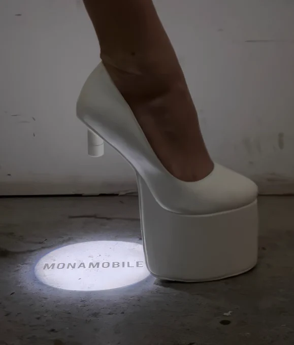 Spotlight Heels Prototype by @monamobile. 

From the designer:
"The projection can be customized with any logo, image, text or color, while the shoe design can be adapted in color, material and sole."

Assisted by @bk.tb .