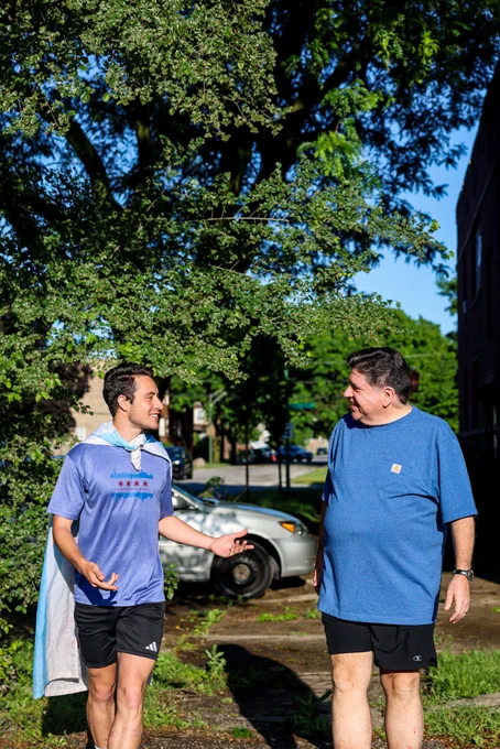 Joabe and Governor Pritzker walk together in Pullman.