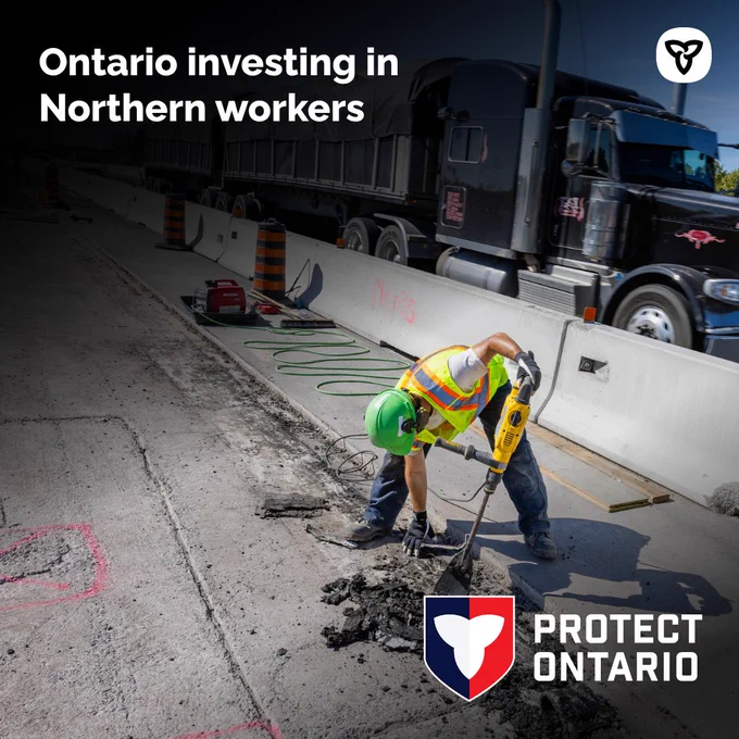 A worker helping build a highway