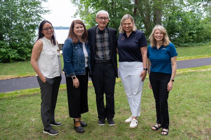 WisDOT Secretary Boardman, Governor Tony Evers, DNR Secretary Karen Hyun, DOA Secretary Kathy Blumenfeld, and Wisconsin Department of Tourism Secretary Anne Sayers posing for photo at park