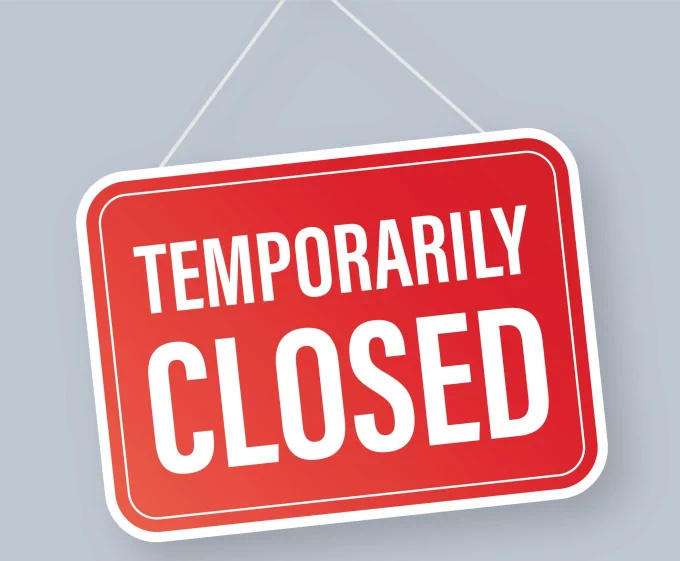 A red sign with the words "temporarily closed."