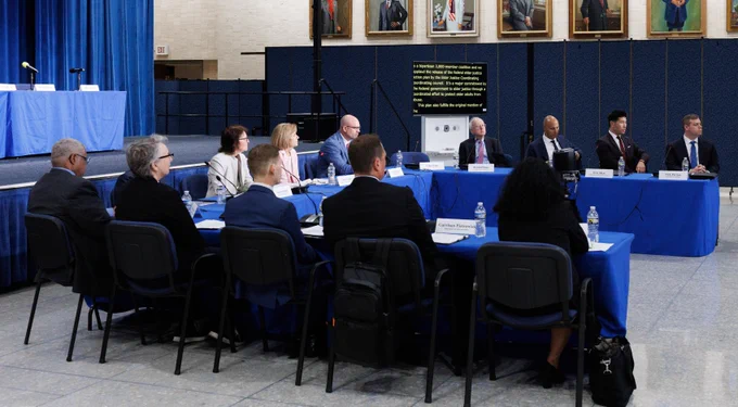 12 people sit around a conference table at the Federal Elder Justice Action Plan Event at HHS, including ACL Principal Deputy Administrator Mary Lazare