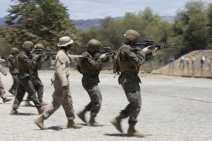 Midshipmen fire M4 carbine\u2019s during Fleet Marine Force training\u202Fwith U.S. Marines with 1st Combat Engineer Battalion, 1st Marine Division at Range 300 at Marine Corps Base Camp Pendleton, California, May 29, 2026. Fleet Marine Force training is a month-long specialized summer program for Marine Option midshipmen, where they engage with key elements of the Marine Air Ground Task Force. Their training includes live-fire ranges, Infantry Immersion Training, land navigation, and exposure to various Military Occupational Specialties. (U.S. Marine Corps photo by Lance Cpl. Mia Ocampo)\n\n