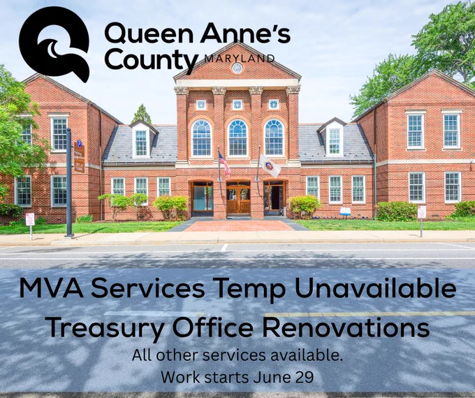 Historic brick government building in Queen Anne's County with flags and announcement about temporary MVA service unavailability due to Treasury Office renovations.