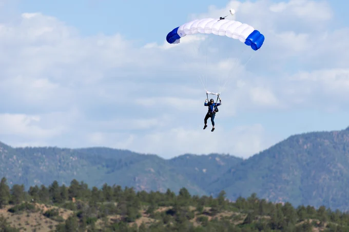 A person parachuting at the U.S. Air Force Academy.