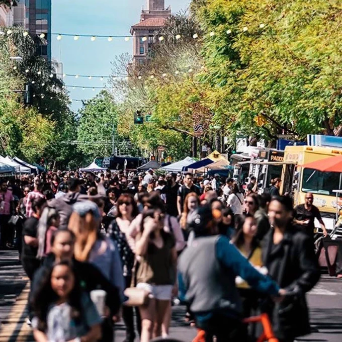 a group of people in a street.