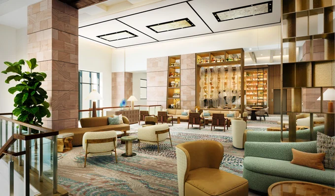 Expanded guest lounge at The Westin Kierland Resort & Spa in Scottsdale Arizona with soft seating bar shelving and open social gathering space
