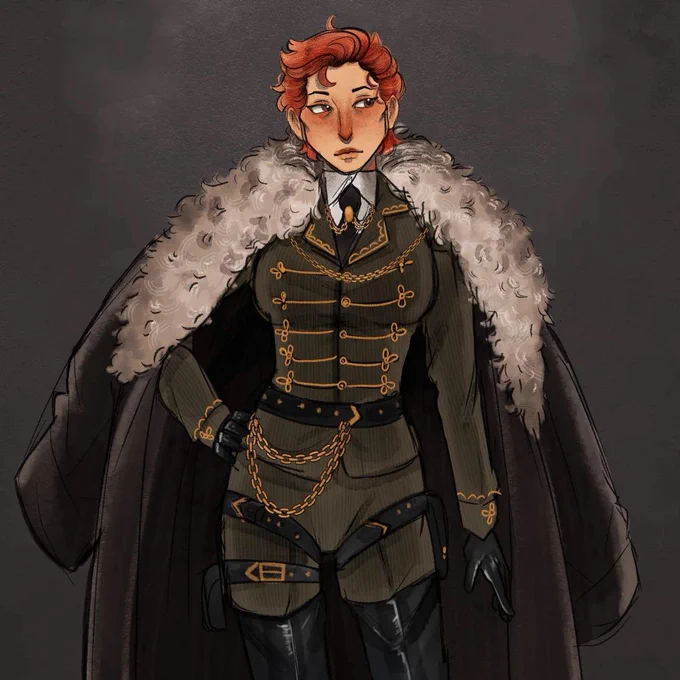 An image of a woman with pale skin and short red hair. She is wearing a militaristic uniform with gold trim. A large furred overcoat is draped over her shoulders.