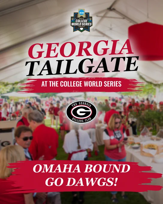 Crowd gathered under a large tent for the Georgia Bulldogs tailgate at the College World Series in Omaha.