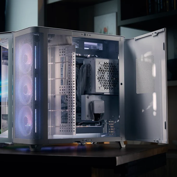 An image of a white CORSAIR Air 5400 case, with open back towards the viewer. The internal components have a pale, soft pink coloration with accents of cobalt blue.