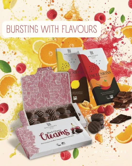 Vibrant image showcasing Whitakers chocolates with splashy fruit backgrounds, highlighting their fruity flavors. Bright and enticing.