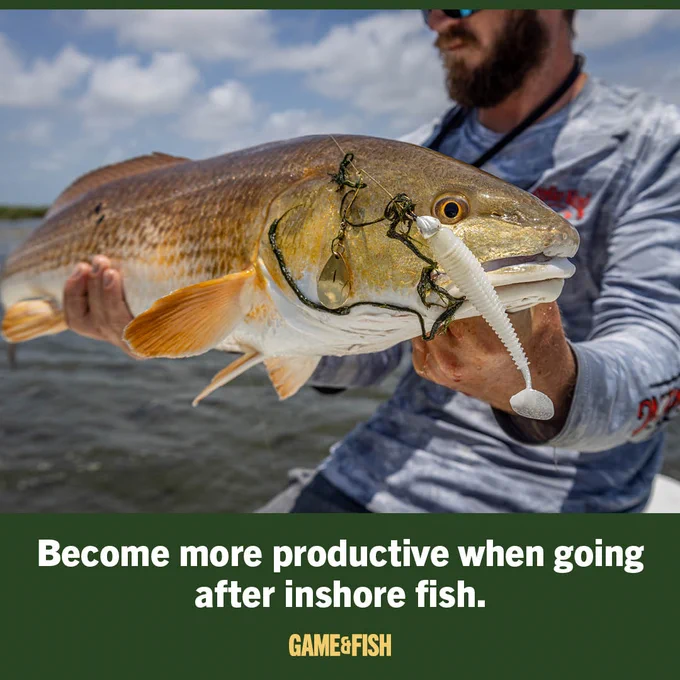 A person holding a large redfish with a fishing lure in its mouth. The image includes text: "Become more productive when going after inshore fish. Game & Fish.