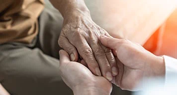 Person holding another persons hands
