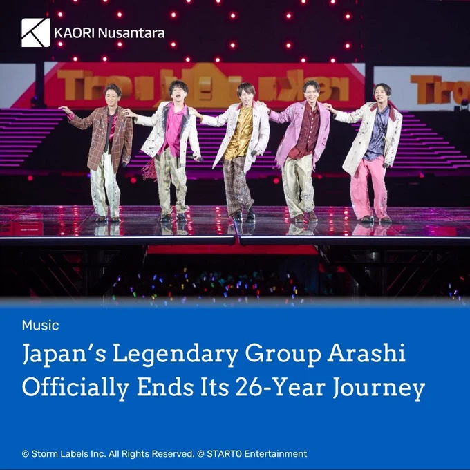 Header image from an article titled Japan’s Legendary Group Arashi Officially Ends Its 26-Year Journey". The article title is written in white over blue background in the bottom half of the image. The picture shows the key visual for the group. Copyright attribution © Storm Labels Inc. All Rights Reserved. © STARTO Entertainment on the bottom left. The article is tagged "Music". The logo of KAORI Nusantara is on top left in white.