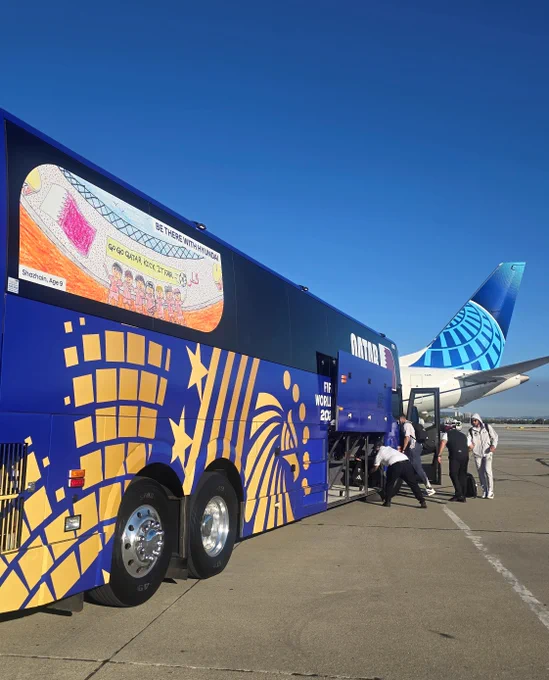 Team Qatar loads luggage on their team bus at San Jose Mineta International Airport.