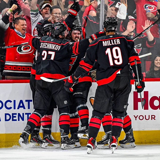 Canes players and fans celebrate after Sebastian Aho's goal tonight.
