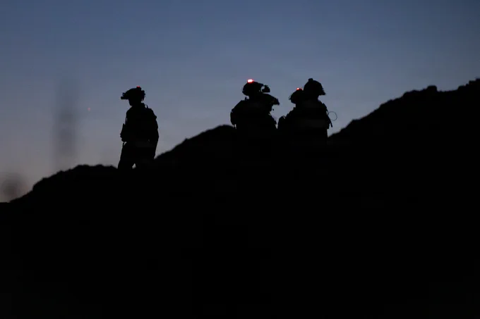 U.S. Marines with 1st Battalion, 24th Marines, 4th Marine Division, conduct pre-combat checks and inspections during a live fire night platoon attack on Range 410 Alpha as part of Integrated Training Exercise 3-26, Marine Corps Air Ground Combat Center Twentynine Palms, California, June 7, 2026. ITX is designed to generate combat readiness and ensure the Reserve Component provides critical strategic depth to the Total Force. From complex combined arms maneuvers to all-domain integration, these Marines are proving that they are ready to augment, reinforce, and fight alongside the active component at a moment's notice. (U.S. Marine Corps photo by Cpl. Van Hoang)\n\n