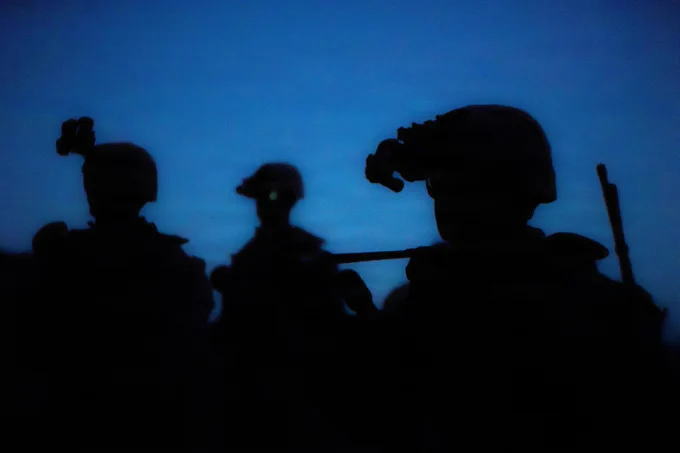 U.S. Marines with 1st Battalion, 24th Marines, 4th Marine Division, maneuver through a wash during a live fire night platoon attack on Range 410 Alpha as part of Integrated Training Exercise 3-26, Marine Corps Air Ground Combat Center Twentynine Palms, California, June 7, 2026. ITX is designed to generate combat readiness and ensure the Reserve Component provides critical strategic depth to the Total Force. From complex combined arms maneuvers to all-domain integration, these Marines are proving that they are ready to augment, reinforce, and fight alongside the active component at a moment's notice. (U.S. Marine Corps photo by Cpl. Van Hoang)\n\n