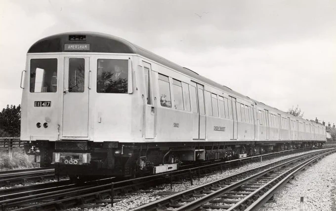 Promotional image of an A60 Stock 4-car unit with an 'Amersham' destination