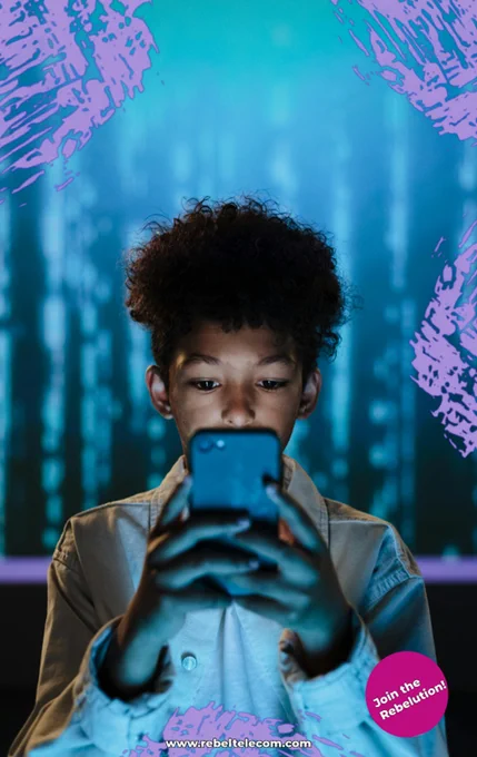 A boy eerily using a smartphone with rebel branding