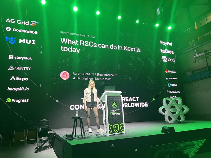 Aurora Scharff presenting on the stage at React Summit 2026.