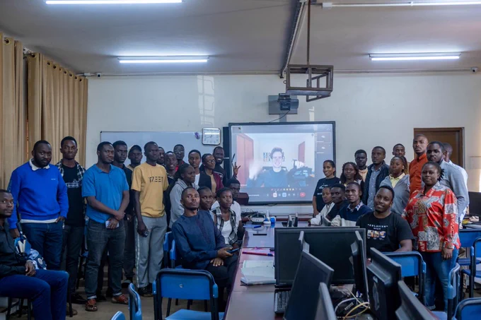 Martha Atukunda & Jacob Mwesigwa (Wal-e Visual team),  with Micheal Morran (Viverse via Video Call) with students at Kyambogo University in the Computer Lab. 