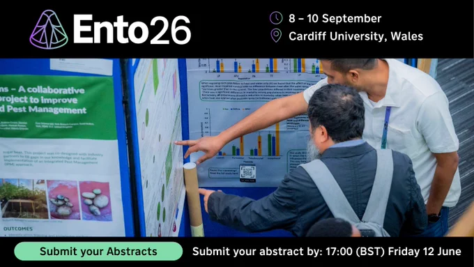 Two people examining detailed scientific posters - Advertisement for the Ento26 conference held at Cardiff University, Wales, from 8-10 September.