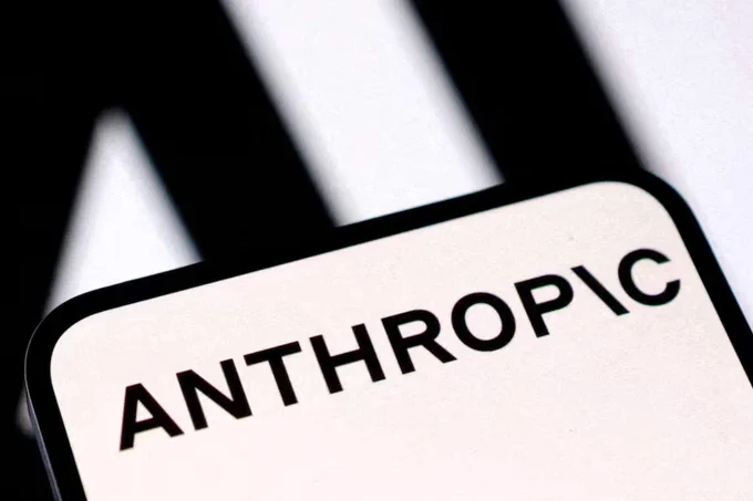 A close-up shot of the white Anthropic brand logo text on a dark background, representing the AI safety company reversing its hidden research restrictions.