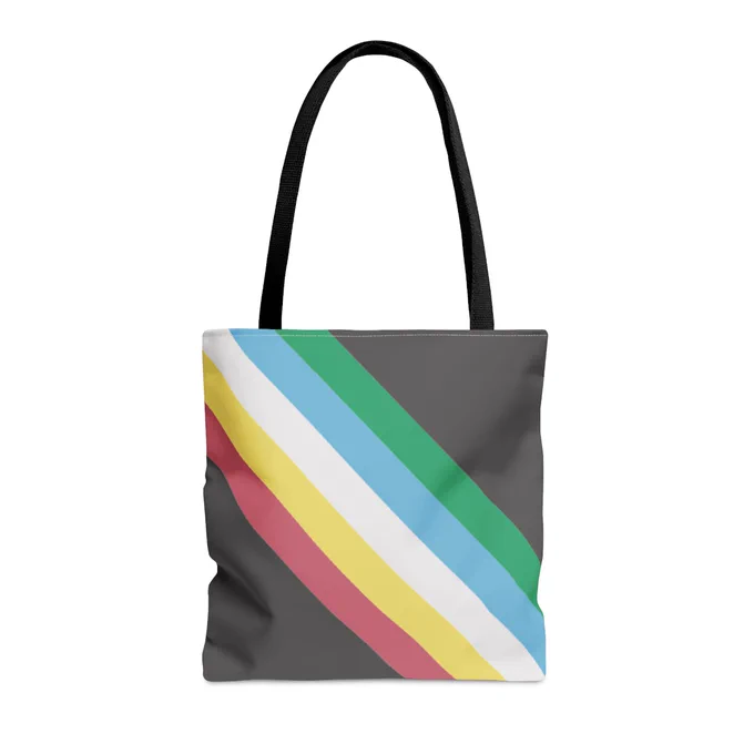 Disability Pride Flag All‑Over Print Medical Supply Tote Bag. The bag is the disability pride flag, which has the colors green, blue, white, yellow and red going diagonally across both the front and bag of the bag.  