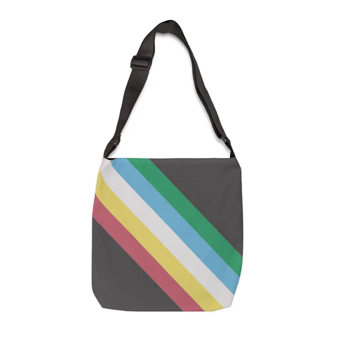 Disability Pride Flag All‑Over Print Medical Supply Tote Bag with Adjustable Straps. The bag has the disability pride flag, which is the colors green, blue, white, yellow and red going diagonally across both the front and bag of the bag.  The bag has an adjustable strap and inside pocket. 