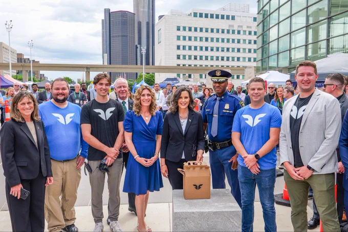 Governor Gretchen Whitmer, Colonel James F. Grady II and other members.