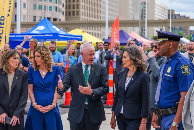 Governor Gretchen Whitmer, Colonel James F. Grady II and other members.