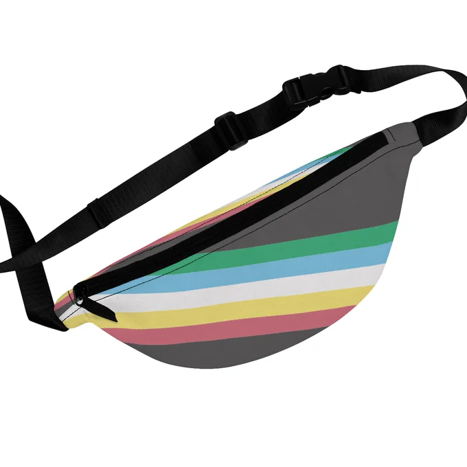 Disability Pride Flag Adaptive Fanny Pack with Adjustable Strap. The fanny pack has the disability pride flag, which is the colors green, blue, white, yellow and red going diagonally across two different areas of the fanny pack.  The fanny pack has an adjustable strap. 
