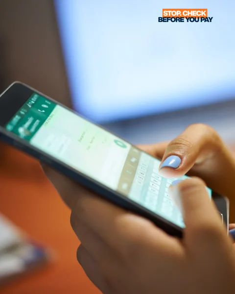 STOP CHECK BEFORE YOU PAY
Image of hand holding mobile device scrolling on screen.