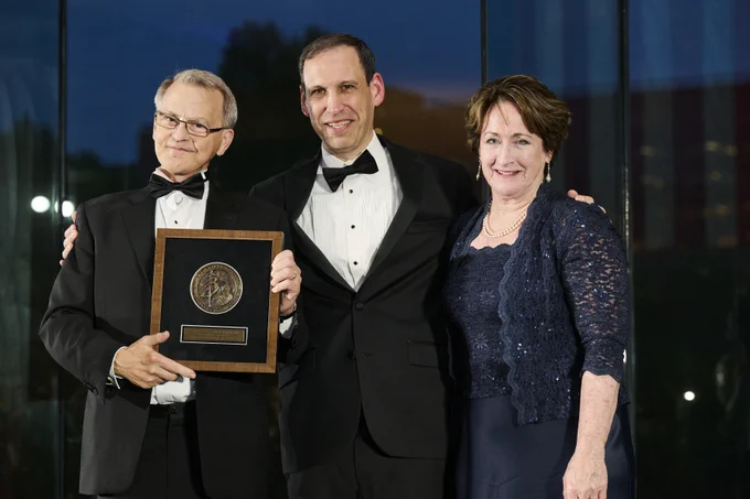 Bill Mumma holding the Canterbury Medal, Mark Rienzi, and Mary Rice Hasson