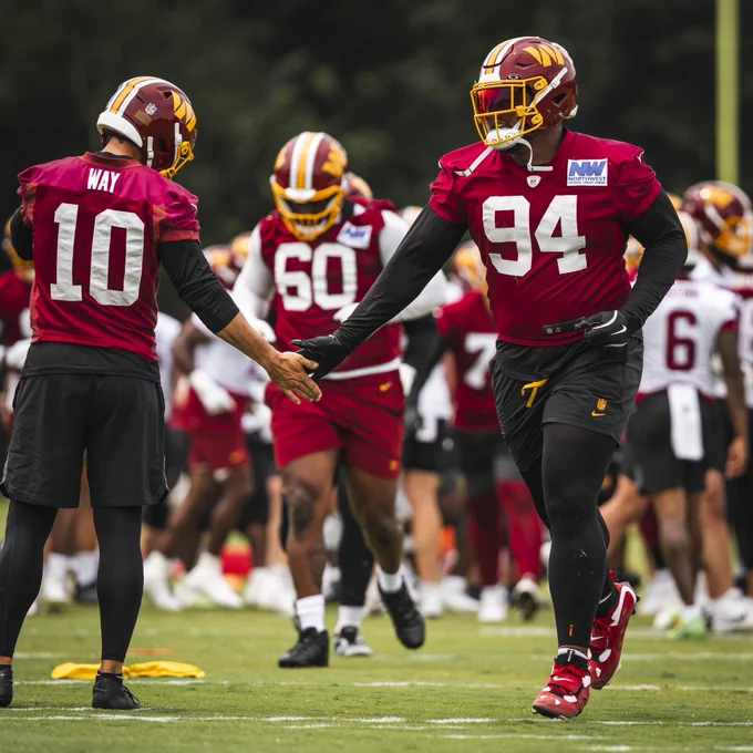 Photo of Daron Payne and Tress Way at practice.