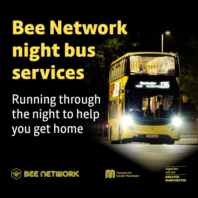 Double-decker Bee Network night bus illuminated on a dark street, providing late-night transport in Greater Manchester.