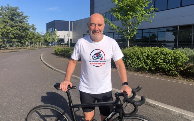 Former Foundation CEO John Shiels prepares to begin his Beautiful Game Tour bike ride.